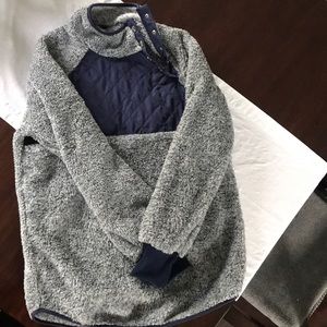 Navy and grey fleece pullover with snap detail